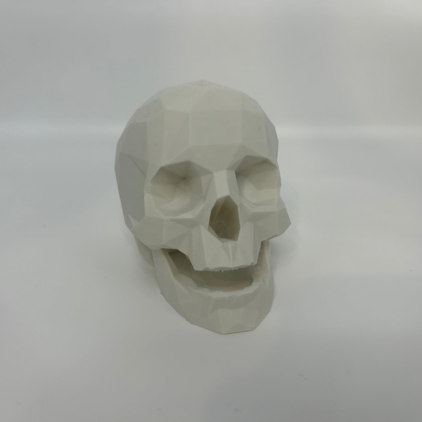medium white low poly skull